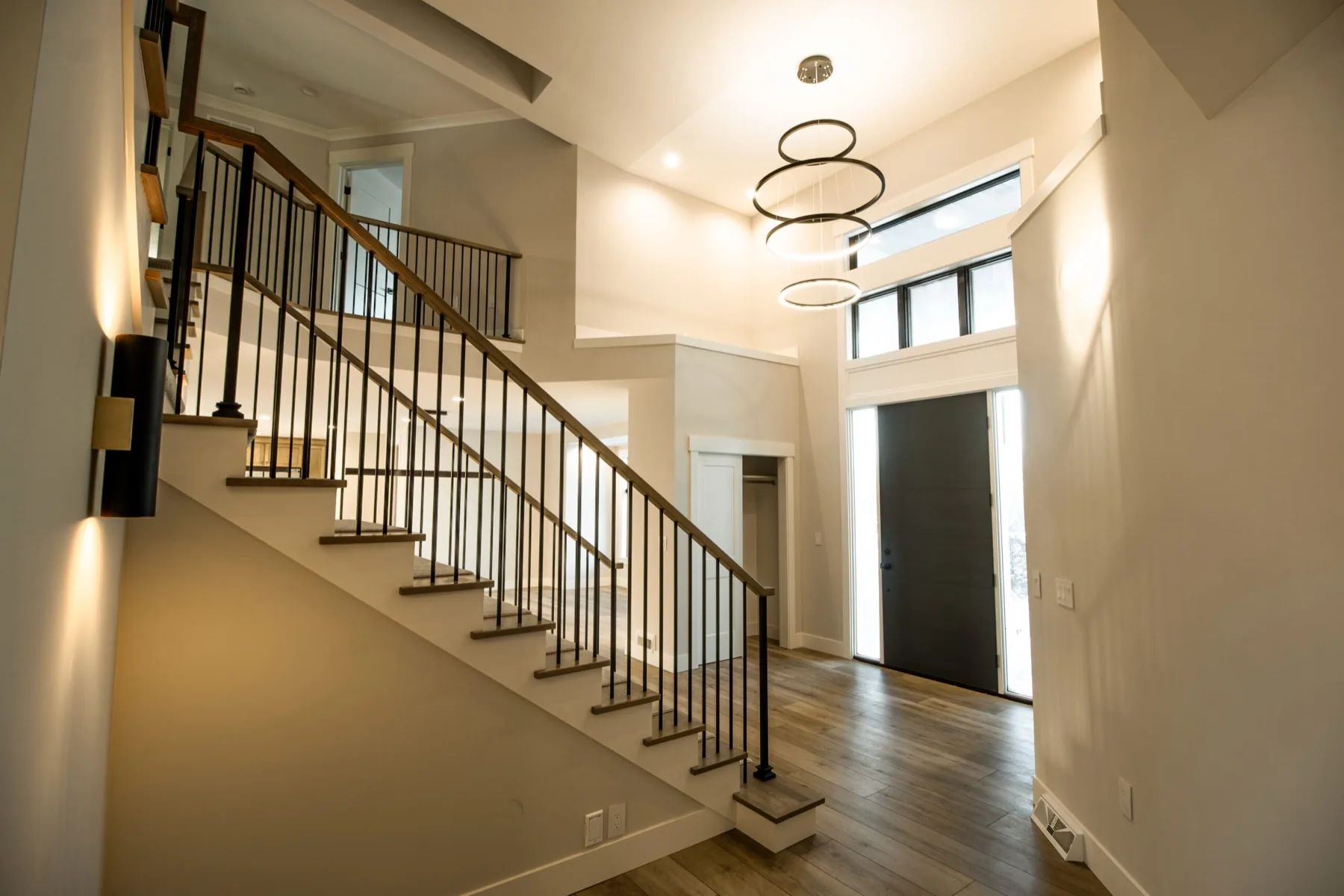 Entry and open stair inside a home built by LOYL Construction
