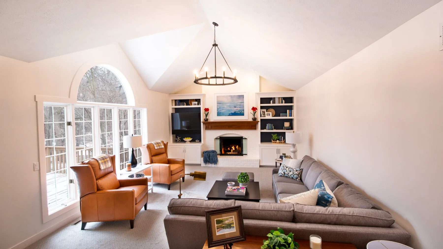 Living room with a fireplace in a LOYL Construction home