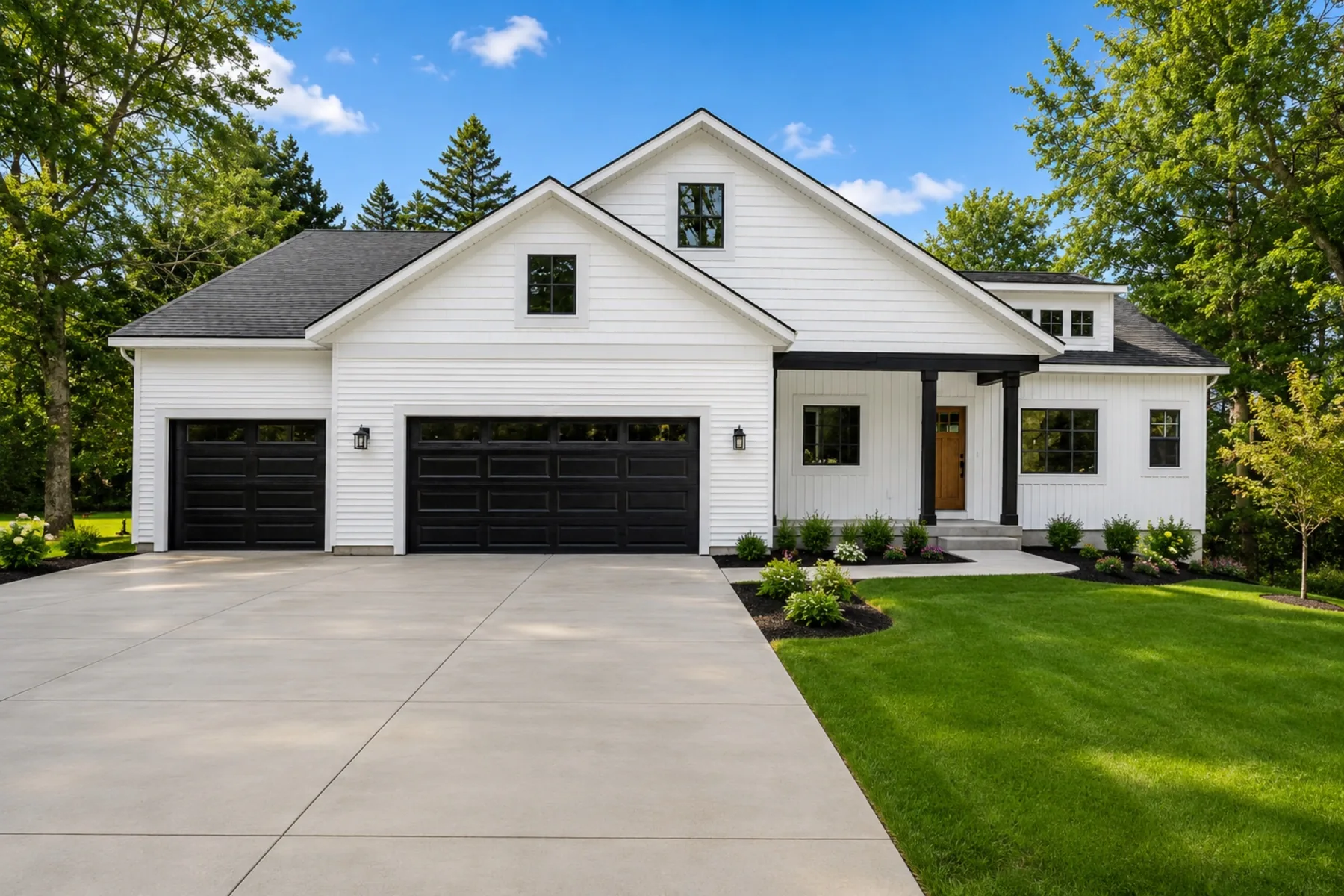 Finished custom home with landscaping and driveway